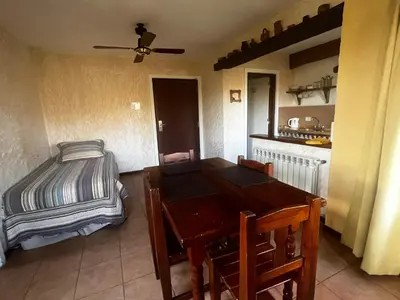 a dining room with a table and a bed at Chalet Suisse Posada & SPA - Adults only in Villa General Belgrano
