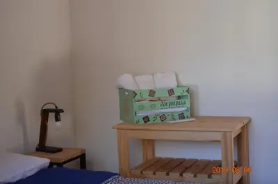 a room with a table with two boxes of towels at Alquimia Cabañas in San Francisco del Monte de Oro