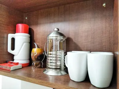 a shelf with cups and a blender on it at M772- Departamento temporal in Cordoba