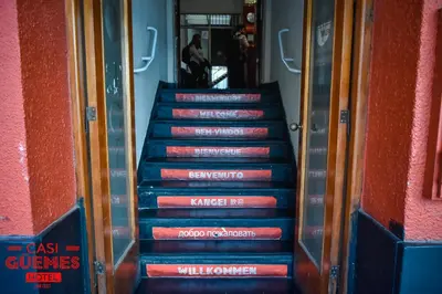 a set of stairs with signs on them at Casi Guemes Hotel in Cordoba
