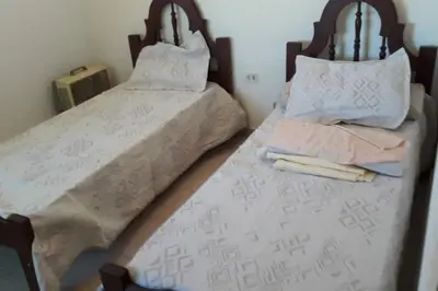 two beds sitting next to each other in a bedroom at DUPLEX - COCHERA CUBIERTA in Cordoba