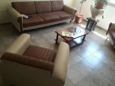 a living room with a couch and a coffee table at DUPLEX - COCHERA CUBIERTA in Cordoba