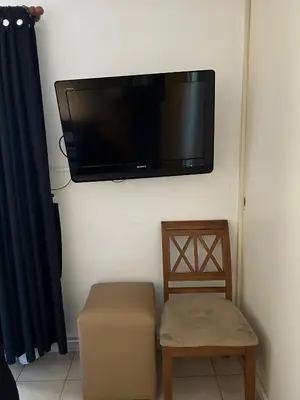 a flat screen tv hanging on a wall at Departamento en Barrio Guemes in Cordoba