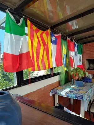 a group of flags hanging in the back of a van at HA! 2 Resi para estudiantes in Cordoba