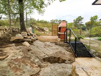 a playground with a gate and some rocks at Solar de Roca in Embalse