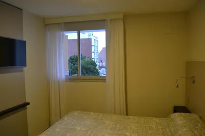 a bedroom with a bed and a window at ESPACIO C Nueva Cordoba in Cordoba