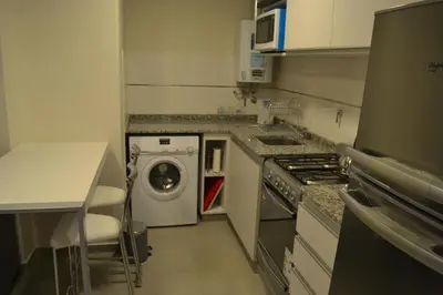 a kitchen with a washing machine and a dishwasher at ESPACIO C Nueva Cordoba in Cordoba