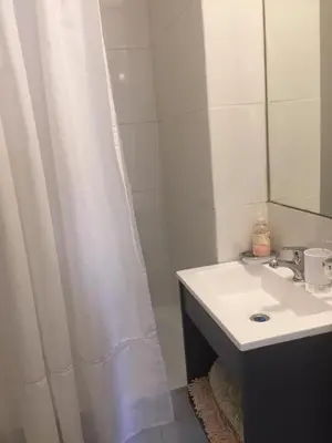 a bathroom with a sink and a shower curtain at ESPACIO C Nueva Cordoba in Cordoba