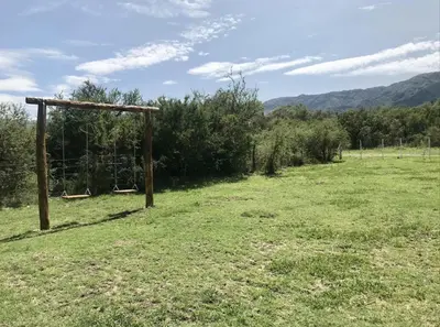 a field with a goal in the middle of a field at Aparts de Montaña Tavullia in Carpintería