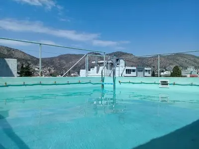 an empty swimming pool with a roller coaster at Abuela Chela in Villa Carlos Paz