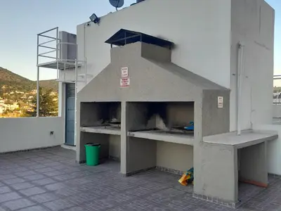a pizza oven on the side of a building at Abuela Chela in Villa Carlos Paz