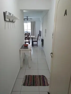 a hallway with a room with a table and chairs at Villasol Temporario in Cordoba