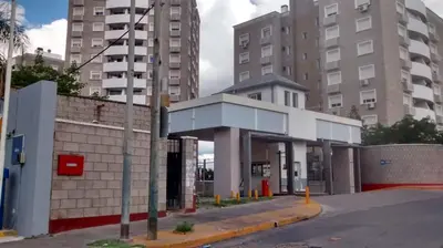 a gas station on a city street with tall buildings at Villasol Temporario in Cordoba