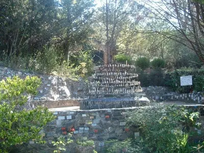 a cemetery with a pile of gravestones in a park at Saint Michel Departamentos para turismo in Alta Gracia