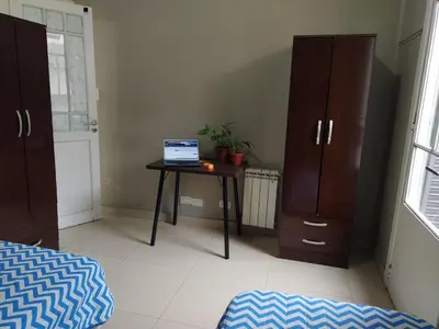 a room with a table with a laptop on it at HA! 1 Resi para estudiantes in Cordoba