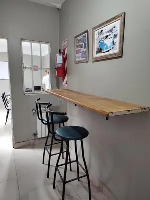a bar with two stools and a counter in a room at HA! 1 Resi para estudiantes in Cordoba