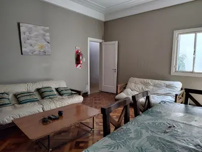 a living room with a couch and a table at HA! 1 Resi para estudiantes in Cordoba