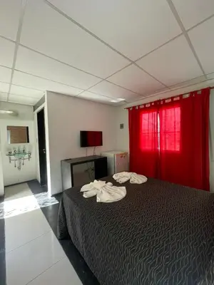 a bedroom with a bed with two towels on it at Alondra Apart in Villa Cura Brochero