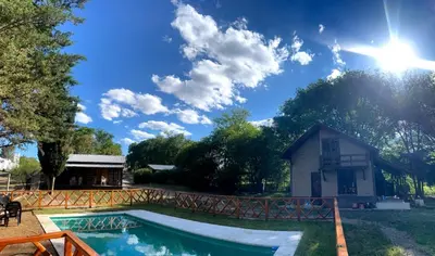 a house with a swimming pool in the yard at Los Teros in Tanti