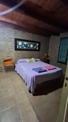 a bedroom with a large bed in a room at Los Teros in Tanti