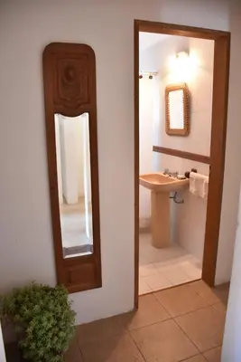 a bathroom with a mirror and a sink at Chalet Tornasol in El Rincón