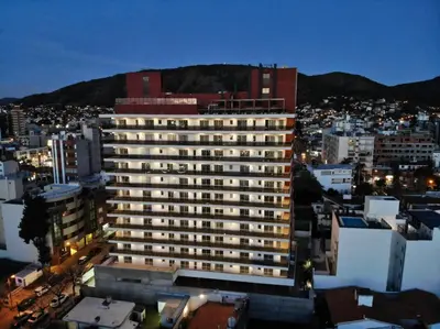 a large building in a city at night at Edificio Leonardo, 5to piso in Villa Carlos Paz