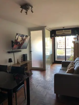 a living room with a couch and a table at 