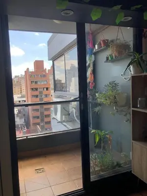 a room with a window with a view of a city at 