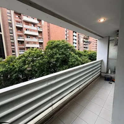 a balcony of a building with bushes and buildings at Jardines del Boulevard 2 in Cordoba