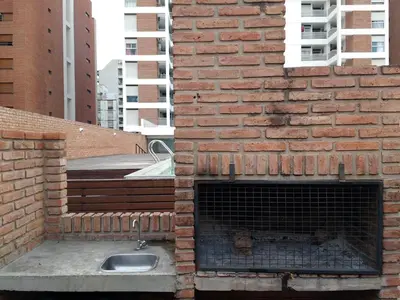a brick wall with a sink and a fireplace at Jardines del Boulevard 2 in Cordoba
