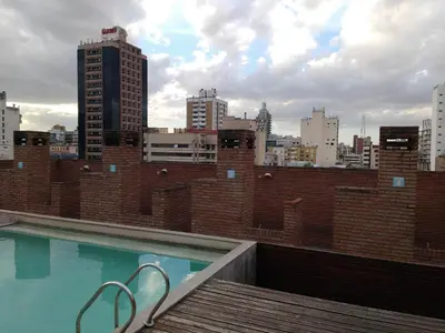 a swimming pool on the roof of a building at Jardines del Boulevard 2 in Cordoba