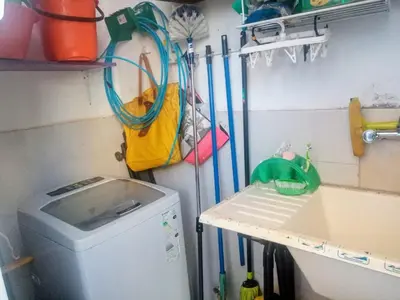 a laundry room with a washing machine and a sink at RAIZ DEL CIELO, entre 2 jardines de ensueño in Cordoba