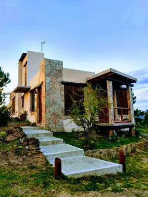 a stone house with stairs in front of it at Terra Nostra in Cordoba