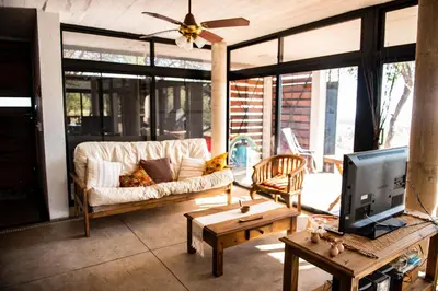 a living room with a couch and a tv at LUMAFACA in La Población