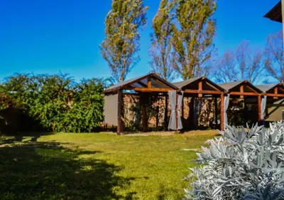 a backyard wedding with a gazebo at Cabañas Brisas del Cerro in Los Reartes
