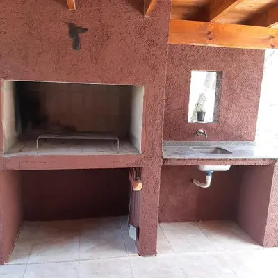 a bathroom with a sink and a counter top at Piscu Yaco in Santa Rosa de Calamuchita