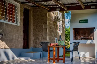 a table and two chairs on a patio at La Querencia in Villa Carlos Paz