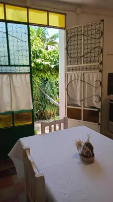 a table with a bowl of food on top of it at La Guadalupana in Mina Clavero