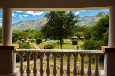a view from a balcony with mountains in the background at El Cortijo Apart - Hotel in Merlo