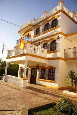 a large building with balconies on it at El Cortijo Apart - Hotel in Merlo