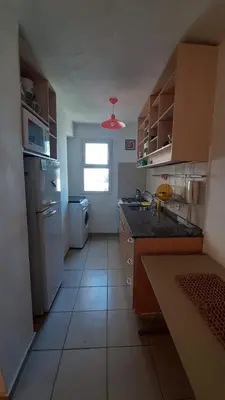 a small kitchen with a sink and a refrigerator at Departamento Fragueiro 2414 terraza exclusiva in Cordoba