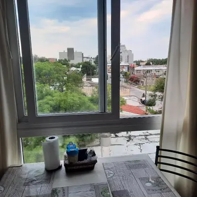a window with a view of a city skyline at CALIDO-Departamento 1 dormitorio amueblado excelente ubicacion in Río Cuarto