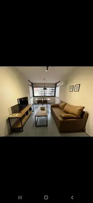 a living room with two couches and a table at Alquiler Temporario en Nueva Córdoba! in Cordoba