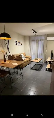 a living room with a couch and a table at Alquiler Temporario en Nueva Córdoba! in Cordoba