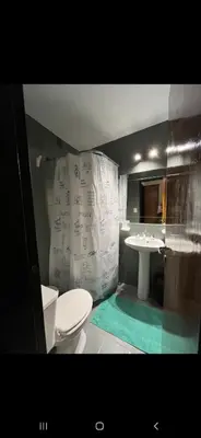 a bathroom with a toilet and a sink at Alquiler Temporario en Nueva Córdoba! in Cordoba