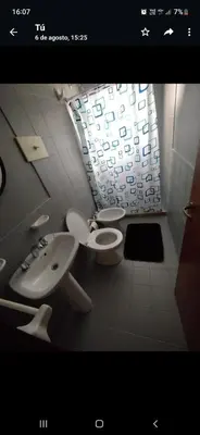 a bathroom with a sink and a toilet and a window at Alquiler Temporario en Nueva Córdoba! in Cordoba