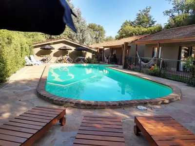 a swimming pool in a yard with a house at Mont Blanc in Villa General Belgrano