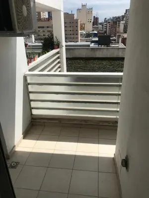 a view of a balcony with a bench on a building at Jardines del Boulevard 3, Nueva cordoba in Cordoba