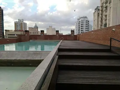 a swimming pool in a city with buildings at Jardines del Boulevard 3, Nueva cordoba in Cordoba