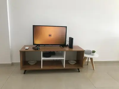 a flat screen tv sitting on top of a desk at Jardines del Boulevard 3, Nueva cordoba in Cordoba